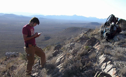 NIU graduate student Adam Smith taking notes and collecting vein samples in the La Popa Basin, Mexico.